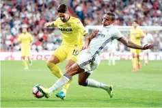  ??  ?? (FILES) This file photo taken on September 21, 2016 shows Villarreal’s Brazilian forward Alexandre Rodrigues“Pato”(L) tackled by Real Madrid’s Brazilian defender Danilo during the Spanish league football match at the Santiago Bernabeu stadium in...