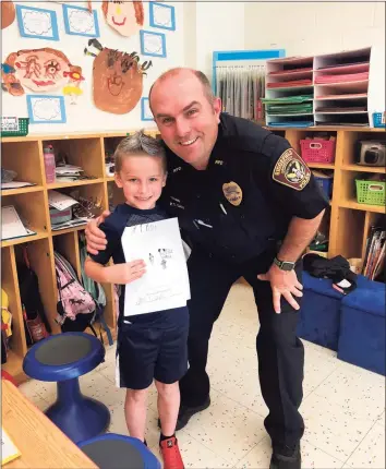  ?? Contribute­d photo ?? Officer Chris Daly is a school resource officer in the elementary as well as the middle school level.