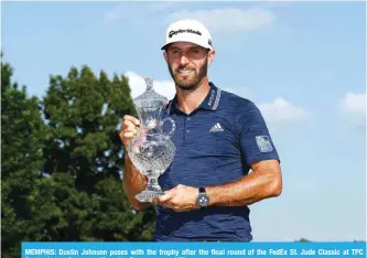  ??  ?? MEMPHIS: Dustin Johnson poses with the trophy after the final round of the FedEx St. Jude Classic at TPC Southwind on Sunday in Memphis, Tennessee. — AFP