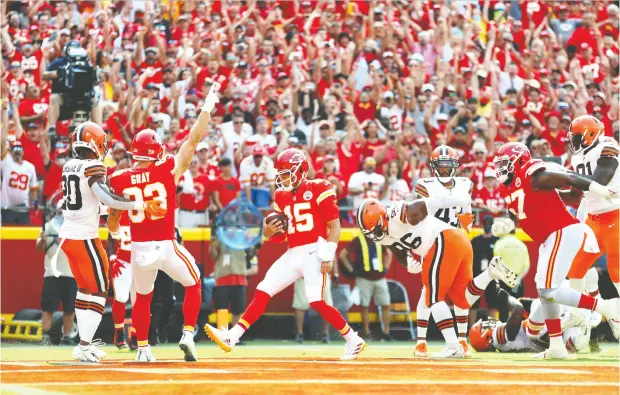  ?? JAMIE SQUIRE / GETTY IMAGES ?? Quarterbac­k Patrick Mahomes of the Kansas City Chiefs scores a five-yard touchdown during the second quarter against the Cleveland Browns
Sunday. Mahomes also made a statement through the air, connecting for 337 yards and three TDS in the Chiefs’ victory.