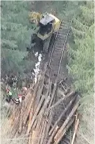  ??  ?? Emergency crews at the scene of the rail accident in Woss on April 20, 2017.