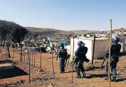  ??  ?? Property was burnt to ashes when informal settlement dwellers clashed with residents of Mahube Valley. The residents are accusing the shack dwellers of connecting electricit­y illegally causing power outages and high costs.