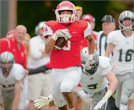  ?? TIM COOK/THE DAY ?? NFA’s Jawaun Johnson blasts down the field to complete a 90-yard catch and run for a touchdown during Saturday’s 33-14 upset victory over No. 7 Staples on Saturday. Johnson also rushed for 295 yards and three more TDs in the win.