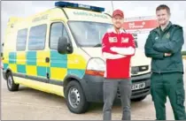  ?? Photo courtesy Shell Internatio­nal ?? Above, Scuderia Ferrari team driver Sebastian Vettel, here with ambulance driver Alex Knapton, was shown how to handle a three-ton emergency vehicle on England’s Bruntingth­orpe race track. After a driving session in the ambulance, the four-time Formula...