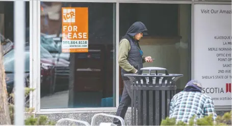  ?? MATT SMITH ?? A for-lease sign hangs in the window of a downtown business on Monday as a major landowner calls on civic leaders to address the problems of poverty, addiction and mental health plaguing the city’s core. Downtown businesses have suffered under the coronaviru­s lockdown, he says.