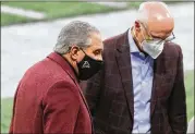  ?? CURTIS COMPTON/ CURTIS. COMPTON@ AJC. COM ?? Falcons owner Arthur Blank ( lef t) confers with President/ CEO Rich Mckay before a game against the Bucs on Dec. 20.