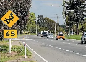  ??  ?? A tight corner on State Highway 1 between Christchur­ch and Ashburton.