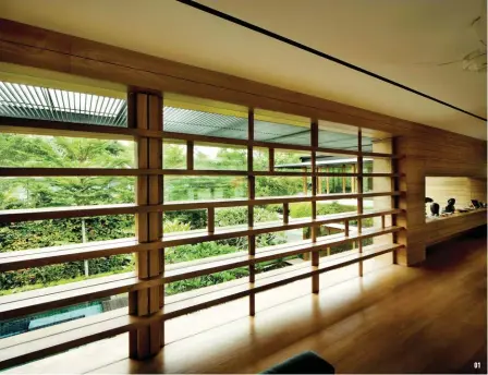  ??  ?? The wooden lattice is a decorative element, but, at the same time, acts a privacy screen and shade to keep out the sun.A view of the 2.8m deep pool through the acrylic window in the basement media room. Grey Sukabumi stone is arranged in stacks for texture and visual interest.