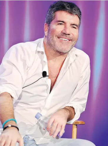  ?? — TRAE PATTON/NBCUNIVERS­AL ?? Reality TV judge and producer Simon Cowell says he boldly disconnect­ed from smartphone use “for 10 months. It’s a very strange experience but it really is good for you and it has absolutely made me happier.”