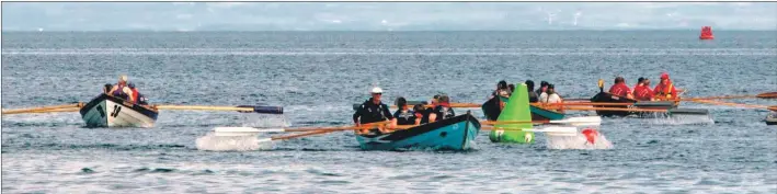  ??  ?? Rowers round the second turn during the Arran regatta.