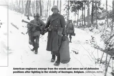  ?? [ARMY.MIL/BOTB] ?? American engineers emerge from the woods and move out of defensive positions after fighting in the vicinity of Bastogne, Belgium.