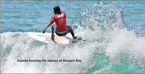  ??  ?? Asanka braving the waters at Arugam Bay