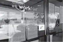  ?? [NAM Y. HUH/ASSOCIATED PRESS FILE PHOTO] ?? Informatio­n signs are displayed June 11 at the closed Illinois Department of Employment Security WorkNet center in Arlington Heights, Ill. U.S. employers advertised for slightly fewer jobs in August while their hiring ticked up modestly.