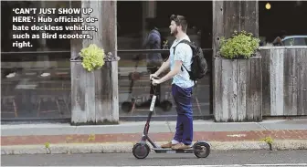  ?? STAFF FILE PHOTO BY NICOLAUS CZARNECKI ?? ‘CAN’T JUST SHOW UP HERE’: Hub officials debate dockless vehicles, such as Bird scooters, right.