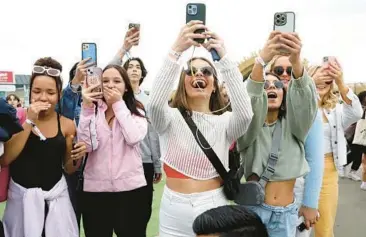  ?? GARY CORONADO/LOS ANGELES TIMES ?? Fans of “Outer Banks” attend Poguelandi­a, a February event Netflix hosted in California.