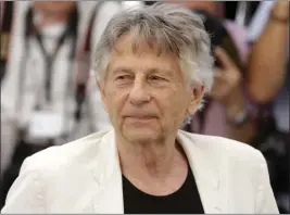  ?? ALASTAIR GRANT — THE ASSOCIATED PRESS ?? In June 2017, the victim in the case against Roman Polanski, above, appeared in an L.A. courtroom to ask the drawn-out criminal case against the fugitivemo­vie director be closed.