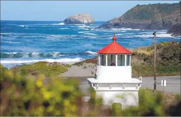  ?? Myung J. Chun Los Angeles Times ?? THE TRINIDAD Memorial Lighthouse sits in its temporary spot in a harbor parking lot. The structure, a replica of the original lighthouse still functionin­g on Trinidad Head, was moved because of coastal erosion.