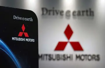  ??  ?? Logos of Mitsubishi Motors Corp are seen at a showroom of the company’s headquarte­rs in Tokyo, Japan May 9. The company made foreign technical trainees from the Philippine­s work on tasks other than those for which they were originally authorised.—...