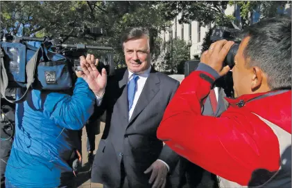  ?? AP PHOTO ?? Paul Manafort makes his way through television cameras as he walks from Federal District Court in Washington, Monday, Oct. 30, 2017.