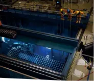  ??  ?? BELOW: Nuclear fuel rods are stored underwater to keep them cool when they leave a reactor