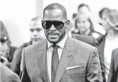  ??  ?? R. Kelly arrives for a child support hearing at a Cook County courthouse in Chicago, Illinois, US on Tuesday. — Reuters photo