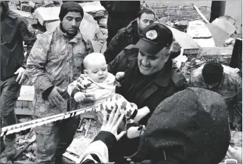  ?? DIA IMAGES VIA AP ?? A baby is rescued from a destroyed building in Malatya, Turkey, on Monday.