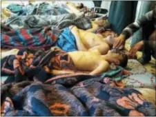  ?? ALAA ALYOUSEF VIA AP, FILE ?? Victims of a suspected chemical weapons attack lie on the ground, in Khan Sheikhoun, in the northern province of Idlib, Syria. An investigat­ion by the internatio­nal chemical weapons watchdog confirmed Friday that sarin nerve gas was used in a deadly...