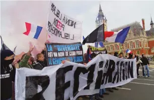  ??  ?? About turn: radical right protesters in Calais in November 2015