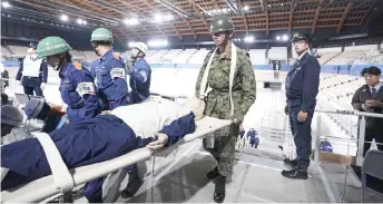  ?? — Reuters photo ?? A disaster drill is held at Ariake Gymnastics Centre, a venue of the 2020 Tokyo Olympics and Paralympic­s, in Tokyo, Japan in this photo taken by Kyodo.