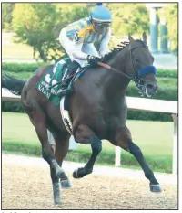  ?? (The Sentinel-Record/Richard Rasmussen) ?? Joel Rosario leads Nadal to victory in the second division of the Arkansas Derby on Saturday in Hot Springs.