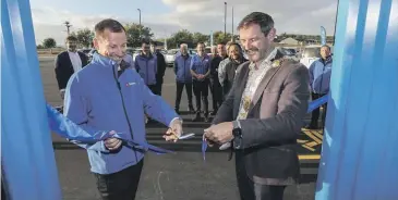  ?? ?? Turners Cars chief executive Greg Hedgepeth, left, and Timaru mayor Nigel Bowen, open the new branch in Washdyke at the former Doncaster Tavern site on Friday. JOHN BISSET/STUFF