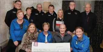  ??  ?? The Chain Gang Cycling Club presented a cheque for €1.000 proceeds of a fund raising cycle on St. Stephen’s day in memory of Nicky Fitzgerald, to the Palliative Care at University Hospital Kerry, sitting from left Margaret Crean KHF, Joanne O’Mahony, Maura Sullivan Treasure KHF, D.J. Fitzpatric­k brother of Nicky Fitzgerald, and Andrea O’Donovan PRO. KHF, back from left Thomas Crowley, Joanne Crowley, Seamus Cotter, John Murray chairman Chain Gang Cycling Club, Andrea O’Connor, Pallative Care, Dave Elton, and Pat Keohane. Photo: John Cleary.