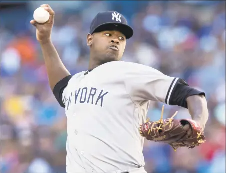  ?? Fred Thornhill / Associated Press ?? Luis Severino picked up his 14th win of the season with a victory over the Blue Jays on Saturday.