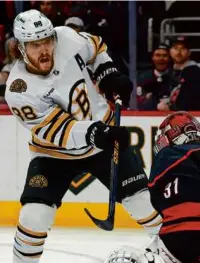  ?? KARL B DEBLAKER/ASSOCIATED PRESS ?? David Pastrnak went top shelf on Hurricanes goaltender Frederik Andersen to give the Bruins a 2-0 lead in the first period.