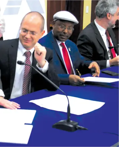  ?? (Photos: Courtesy) ?? CONGRESSMA­N BILL JOHNSON, one of the cochairs of the Congressio­nal Israel Victory Caucus, signs the joint declaratio­n with Knesset Israel Victory Caucus co-chairs MKs Oded Forer and Avraham Neguise, and Prof. Daniel Pipes (in the background), at a joint meeting of the CIVC and the KIVC in Congress.