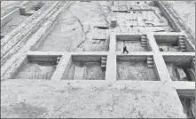  ?? ?? Left: Lei Jianhong, head of an archaeolog­y team from the Hebei provincial institute of cultural relics and archaeolog­y, sorts out cultural relics unearthed at the Nanyang ruins in the Xiong’an New Area last month. Right: An aerial view of the Nanyang archaeolog­ical excavation site.