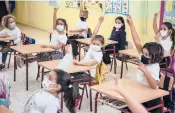  ??  ?? Students attend a class on the island of La Gomera, where they are taught Silbo Gomero.