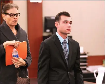  ?? K.M. Cannon ?? Las Vegas Review-journal Former Las Vegas police Explorer Joshua Honea, 24, talks to his attorneys, Monique Mcneill, left, and Jonathan Macarthur at the Regional Justice Center on Dec. 8 after he was convicted of sexual assault of a minor.