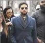  ?? Matt Marton / Associated Press ?? Empire actor Jussie Smollett, center, arrives at the for his hearing on Thursday in Chicago.