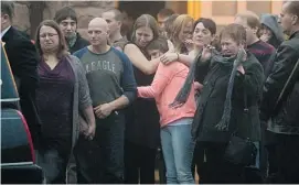  ?? ANDREW VAUGHAN /THE CANADIAN PRESS ?? Family and friends gather Tuesday in Cap-Pelé, N.B., at the funeral for four teens killed in a car crash in nearby Notre-Dame on Saturday. Justin Léger, Sebastien Léger, Justin Brown and Luc Arsenault died on Saturday.