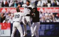  ?? Frank Franklin II / Associated Press ?? The New York Yankees’ Gleyber Torres, center, celebrates with Josh Donaldson after driving in the winning run during the ninth inning against the Cleveland Guardians on Saturday.