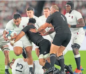  ?? Picture: Getty. ?? England’s Billy Vunipola is tackled by Ardie Savea of New Zealand during the World Cup semi-final in Yokohama.