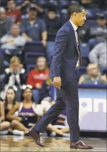  ?? Jessica Hill / Associated Press ?? UConn coach Kevin Ollie walks off the court during the second half against Memphis on Sunday in Storrs.