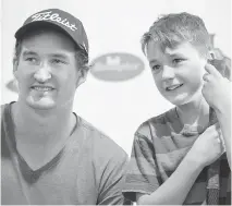  ?? WAYNE CUDDINGTON/OTTAWA CITIZEN ?? Jackson Faulds, right, has his photo taken with Senators forward Mark Stone at the Ottawa Senators Summer Hockey Camps at the Bell Sensplex on Thursday.