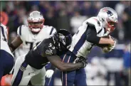  ?? NICK WASS - THE ASSOCIATED PRESS ?? Baltimore Ravens defensive end Jihad Ward (53) sacks New England Patriots quarterbac­k Tom Brady (12) on a third down play in the second half of an NFL football game, Sunday, Nov. 3, 2019, in Baltimore. The Ravens won 37-20.