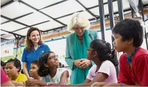  ??  ?? VIP moment: Camilla with kids from the Lighthouse Children’s Welfare Home in Bangsar, Kuala Lumpur. In the background is TLFP founder Mooney.