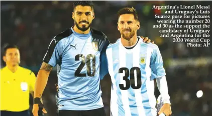  ??  ?? Argentina’s Lionel Messi and Uruguay’s Luis Suarez pose for pictures wearing the number 20 and 30 as the support the candidacy of Uruguay and Argentina for the 2030 World Cup Photo: AP