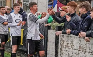  ?? Jacob Reader ?? ●●Captain Michael Gervin celebrates with supporters after Bacup Borough reached the Edward Case Cup final