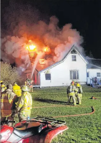  ?? SUBMITTED PHOTO ?? Kinkora Firefighte­rs fight to bring a tough fire in South Freetown under control, Monday night.