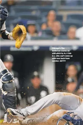  ??  ?? Chicago’s Tim Anderson scores on wild pitch by A.J. Cole (r.), who can’t come up with toss back from catcher. GETTY